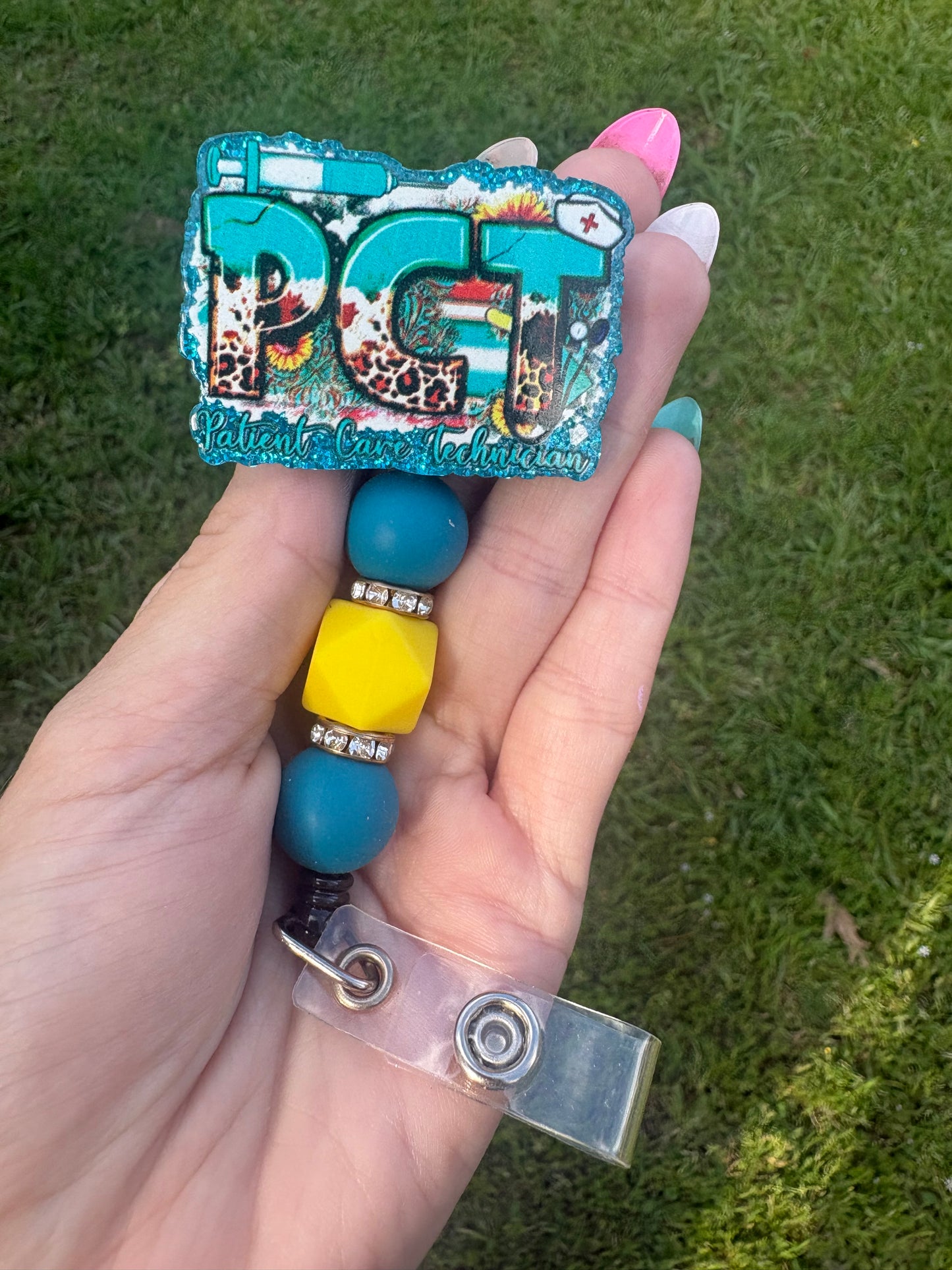 Patient care tech badge reel