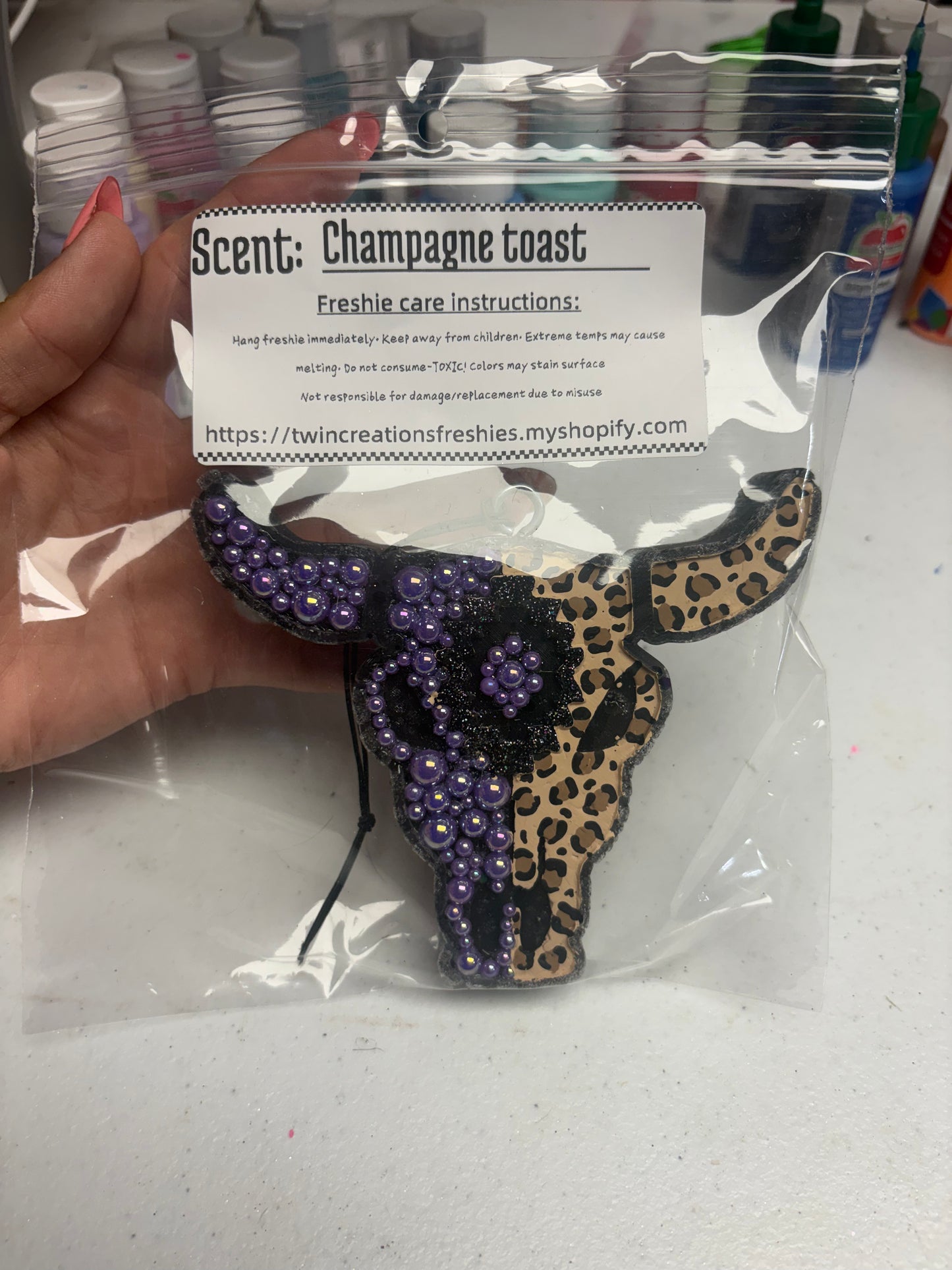 Cheetah rhinestone purple bull skull in champagne toast