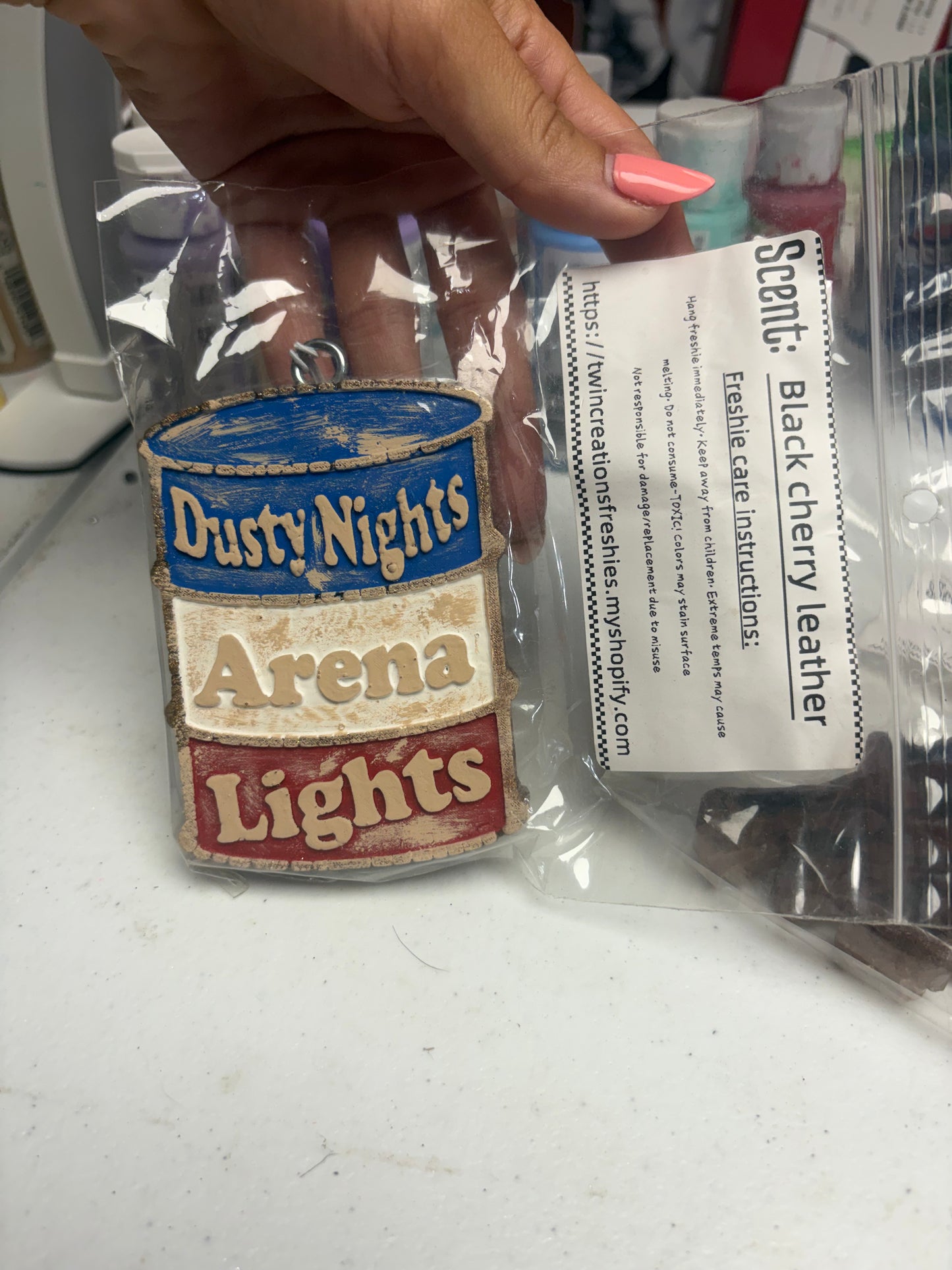 Dusty nights arena lights in black cherry leather